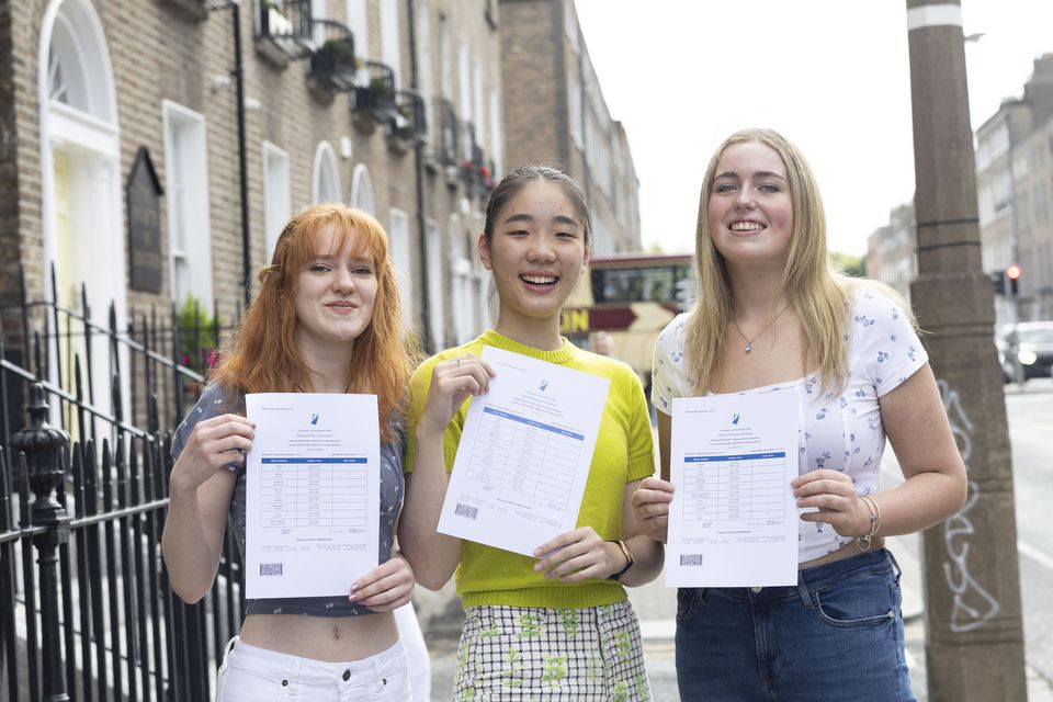 Leaving Cert Students from the Institute of Education, Aoife Cashman, Ai Lin Sun and Louise Doyle outside their school after getting a maximum of 625 points each. Photo: Sam Boal/Collins Photos